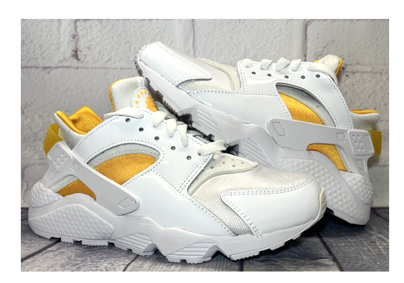 Białe damskie sneakersy Nike Air Huarache DR5727100 r. 36,5 z pomarańczowymi elementami Laser Orange