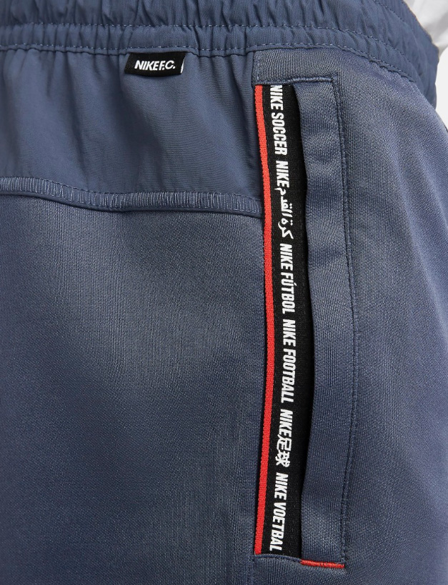 Niebieskie spodnie męskie Nike F.C. Tribuna Football DC9067-437 XXL bok z logowaną taśmą