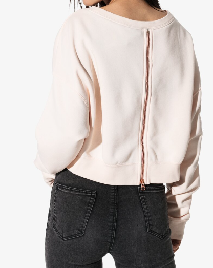 Boczny widok pomarańczowej damskiej bluzy Nike Air Sportswear Rally Crew AV6227-838 XS z mankietami