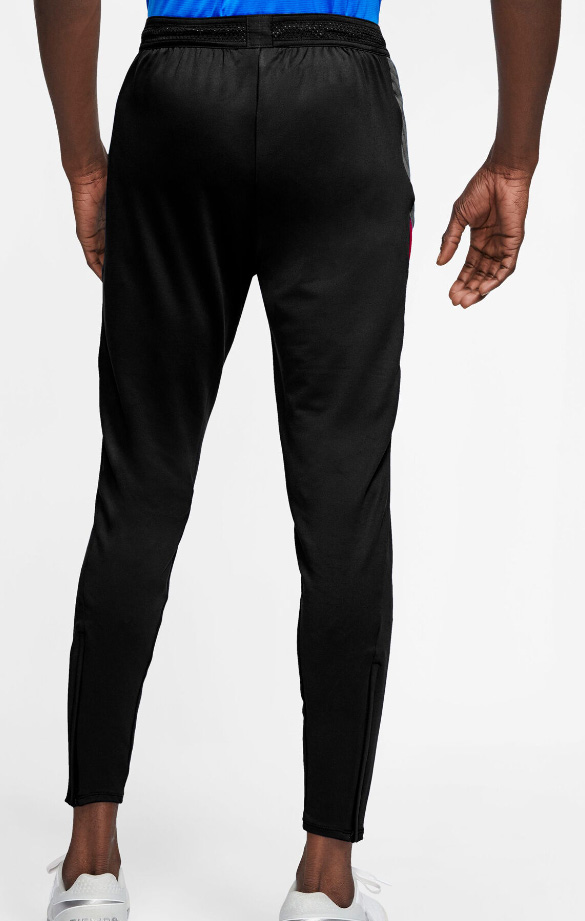 Czarne spodnie junior Nike Dri-FIT Strike BV9460011 128-137 cm bok z siateczkowymi wstawkami