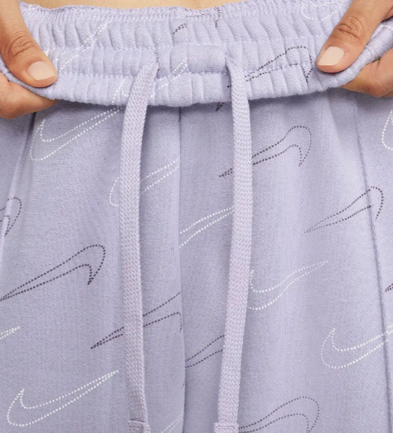 Fioletowe spodnie dresowe damskie Nike DR8919-510 L bok z przeszyciami