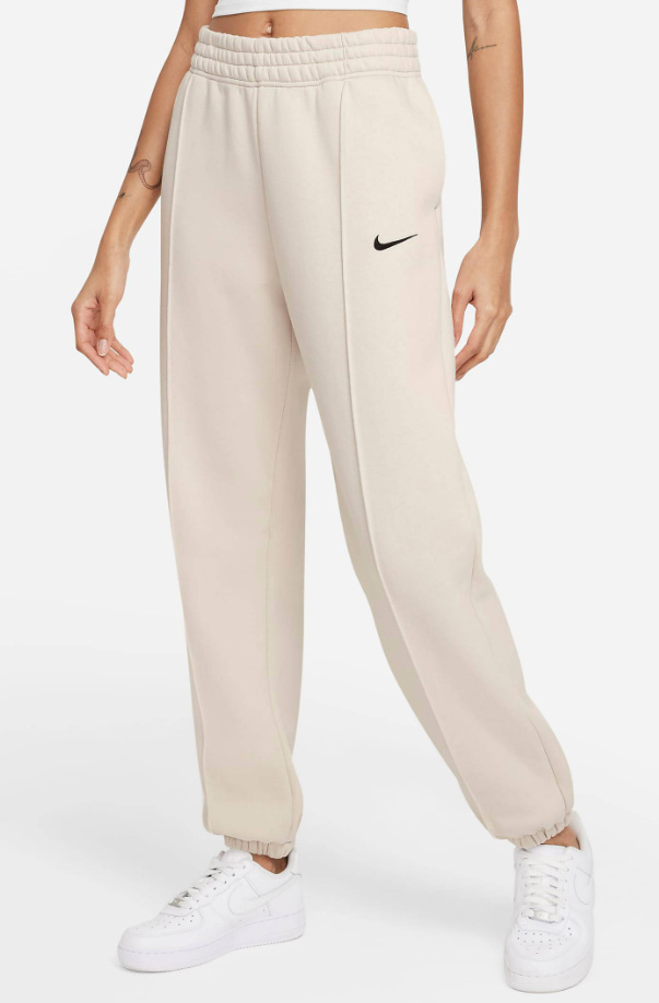 Beżowe spodnie dresowe damskie Nike DQ0388-058 XXL przód z logo Swoosh