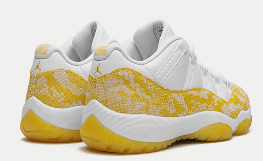 Boczny widok żółtych damskich butów Air Jordan 11 Retro Low AH7860-107 44 z gumową podeszwą i siateczką