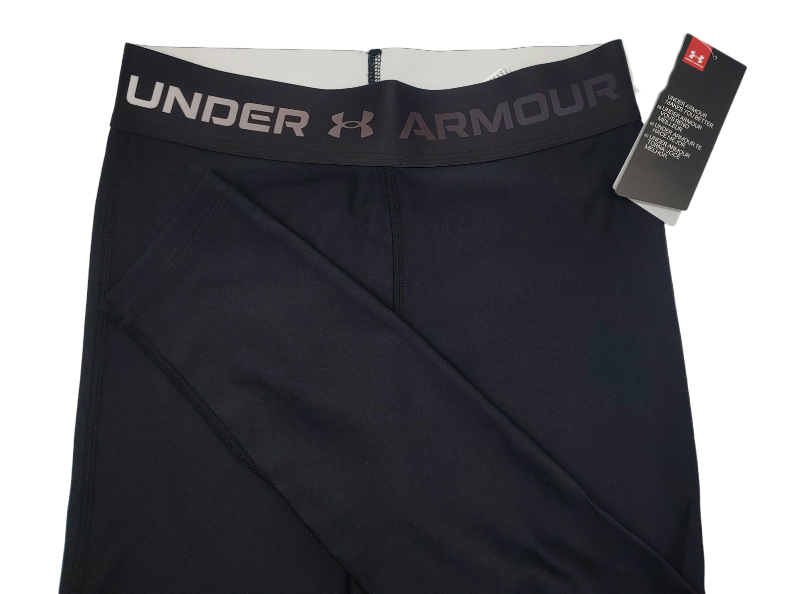 Damskie czarne legginsy Under Armour HeatGear 1361043-001 SM bok z minimalistycznym designem