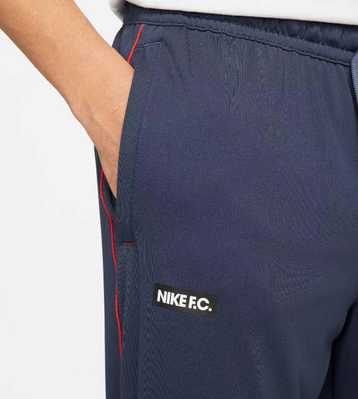 Granatowe spodnie dresowe męskie Nike F.C. Libero Dri-FIT DH9666-437 S bok z logo Nike