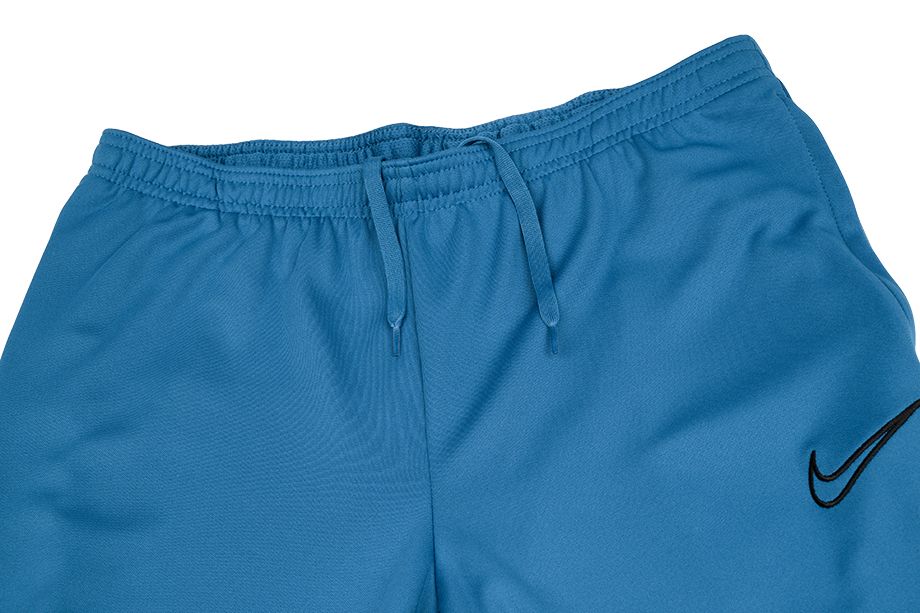 Boczny widok niebieskich męskich spodni Nike Dri-FIT Academy CW6122-407 S z rozcięciami na nogawkach
