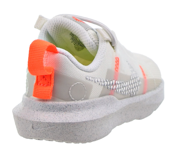 Białe dziecięce sneakersy Nike Crater Impact DB3553100 r. 26 bok z piankową podeszwą