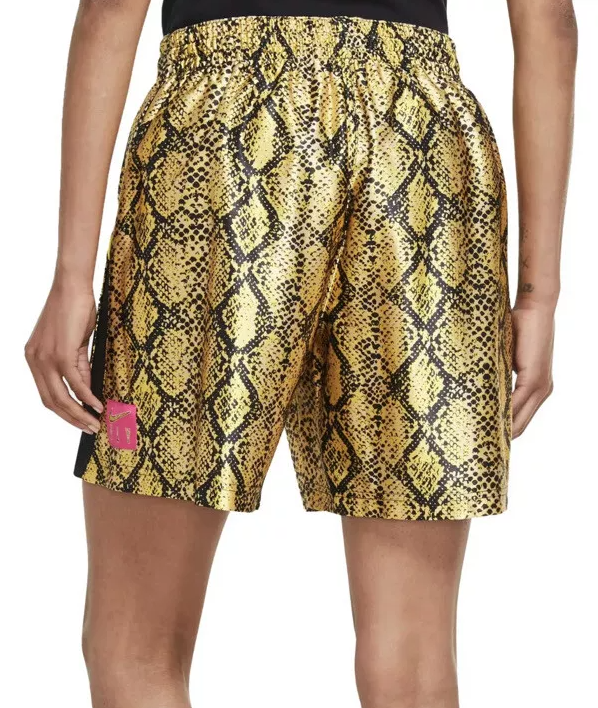 Złote spodenki damskie Nike Fly Rebel S bok z logo Swoosh Fly