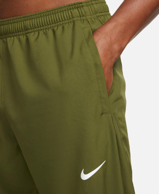 Zielone spodnie męskie Nike Dri-FIT Challenger DD4894326 r. M bok z nogawką na zamek