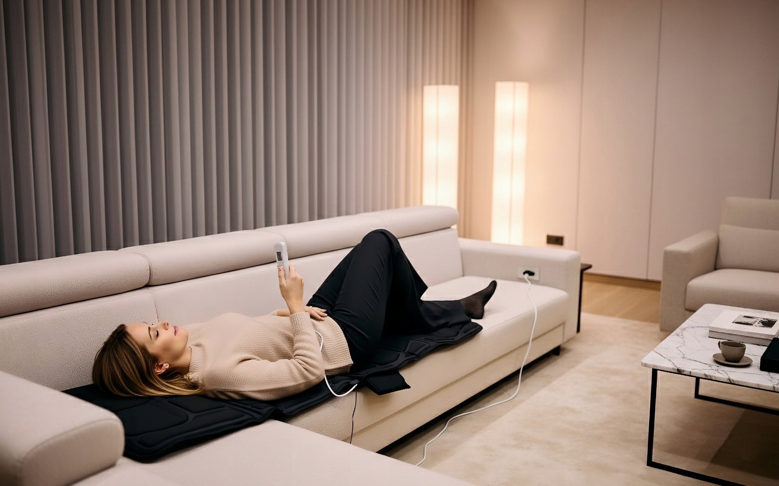 Przycisk regulacji intensywności na pilocie maty HeatMat Warmener™