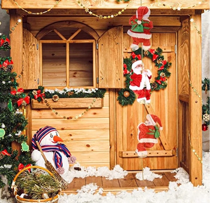 WSPINAJĄCY SIĘ MIKOŁAJ GRA ŚPIEWA ŚWIECI ŚWIĘTA NA PREZENT