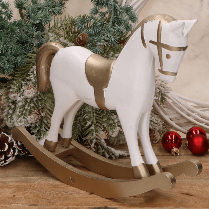 Drewniany koń na biegunach ze złotymi elementami 26,5x23cm