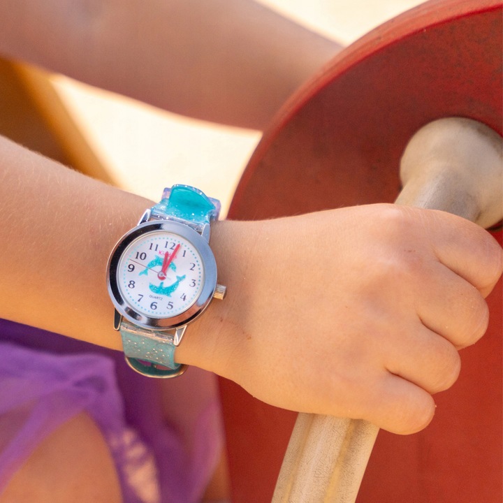 Girls' wrist watch with glitter. Includes exercises for learning the