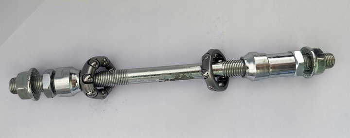 Oś piasty koła tył na wolnobieg kompletna +łożyska