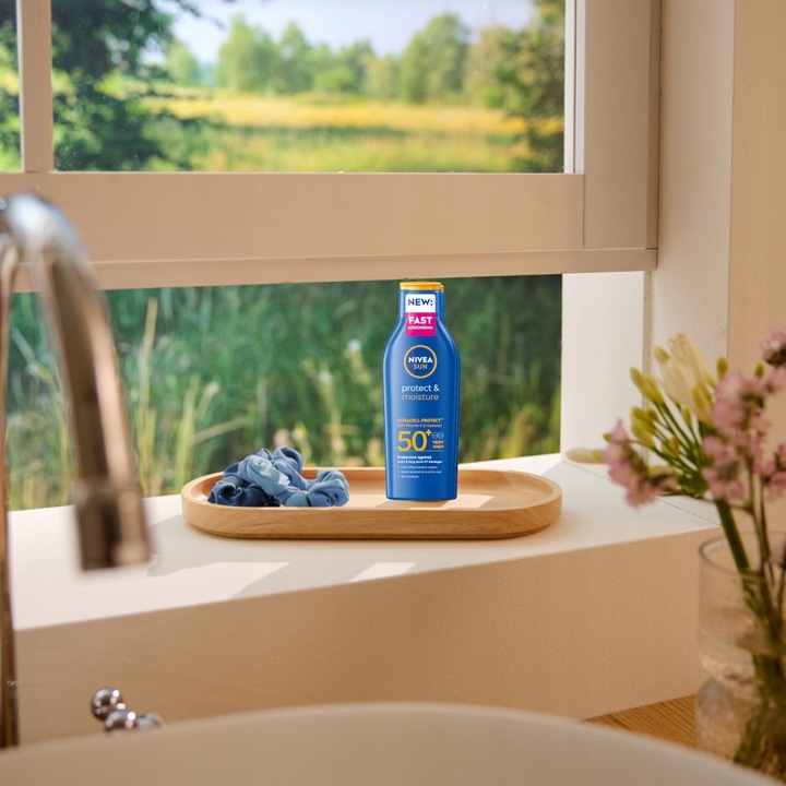 NIVEA SUN Protect & Moisture Nawilżający balsam do opalania SPF 50+, 200 ml