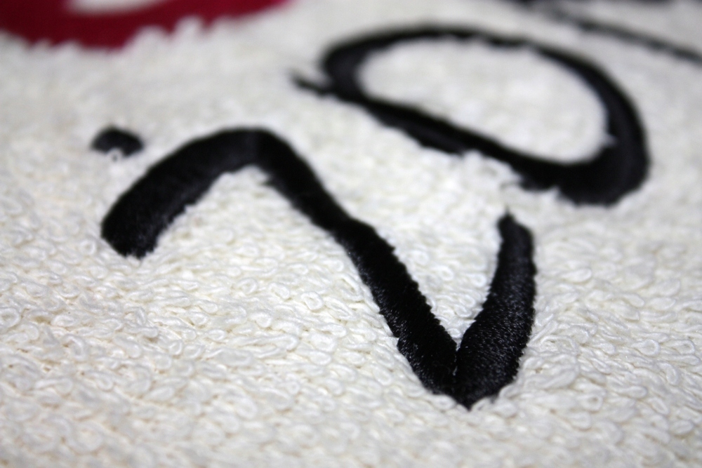 Bawełniane ręczniki haft komputerowy TANIO logo