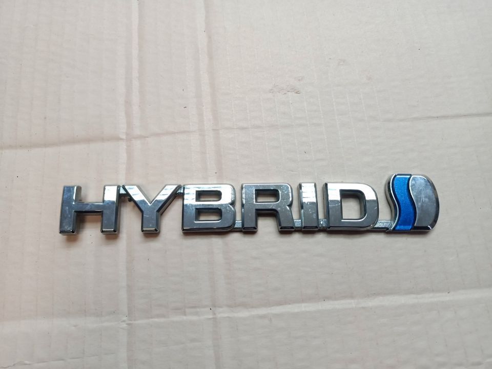 TOYOTA AURIS II 2012- ZNACZEK EMBLEMAT NAPIS BŁOTNIKA HYBRID 75374-12010