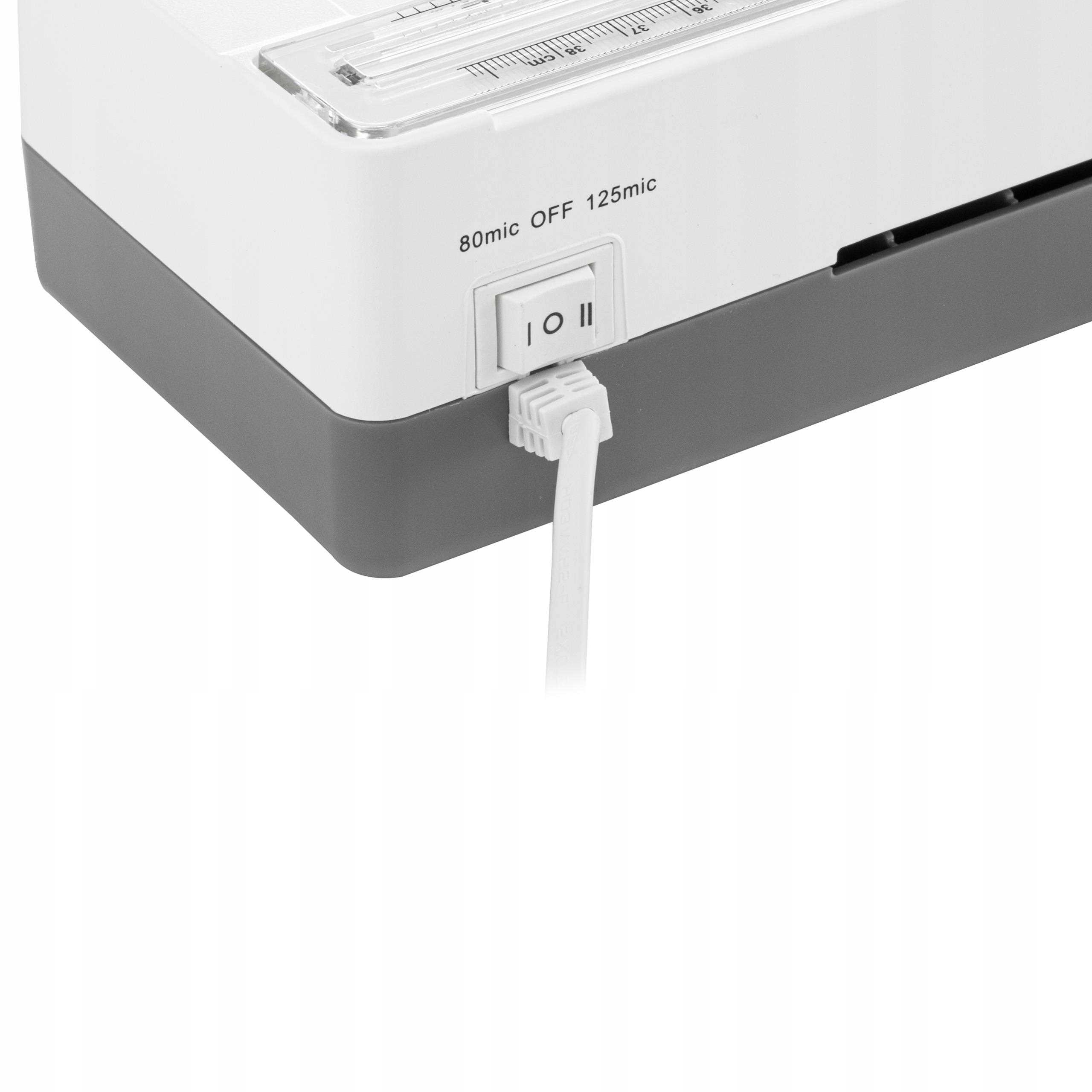 Kompletny zestaw: laminator, folie i instrukcja, gotowy do użycia.